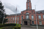 a picture of Trafford Town Hall on a grey gloomy day 