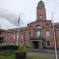 a picture of Trafford Town Hall on a grey gloomy day 